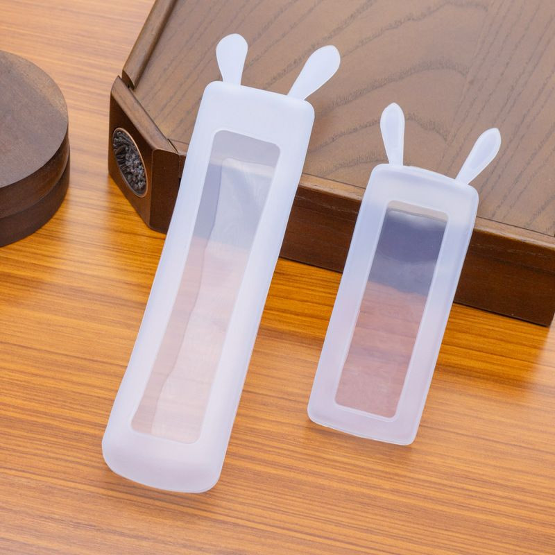 Housse de protection en silicone transparent pour télécommandes présentent un design amusant avec des oreilles de lapin.